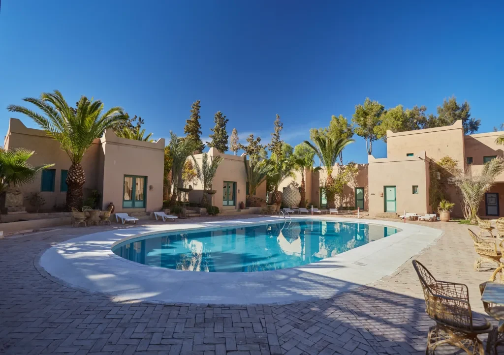 A private swimming pool and shaded terrace at a Marrakech villa